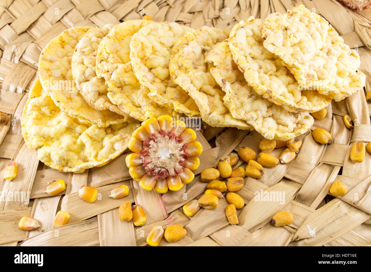 circle shaped corn snacks and corn kernels Stock Photo