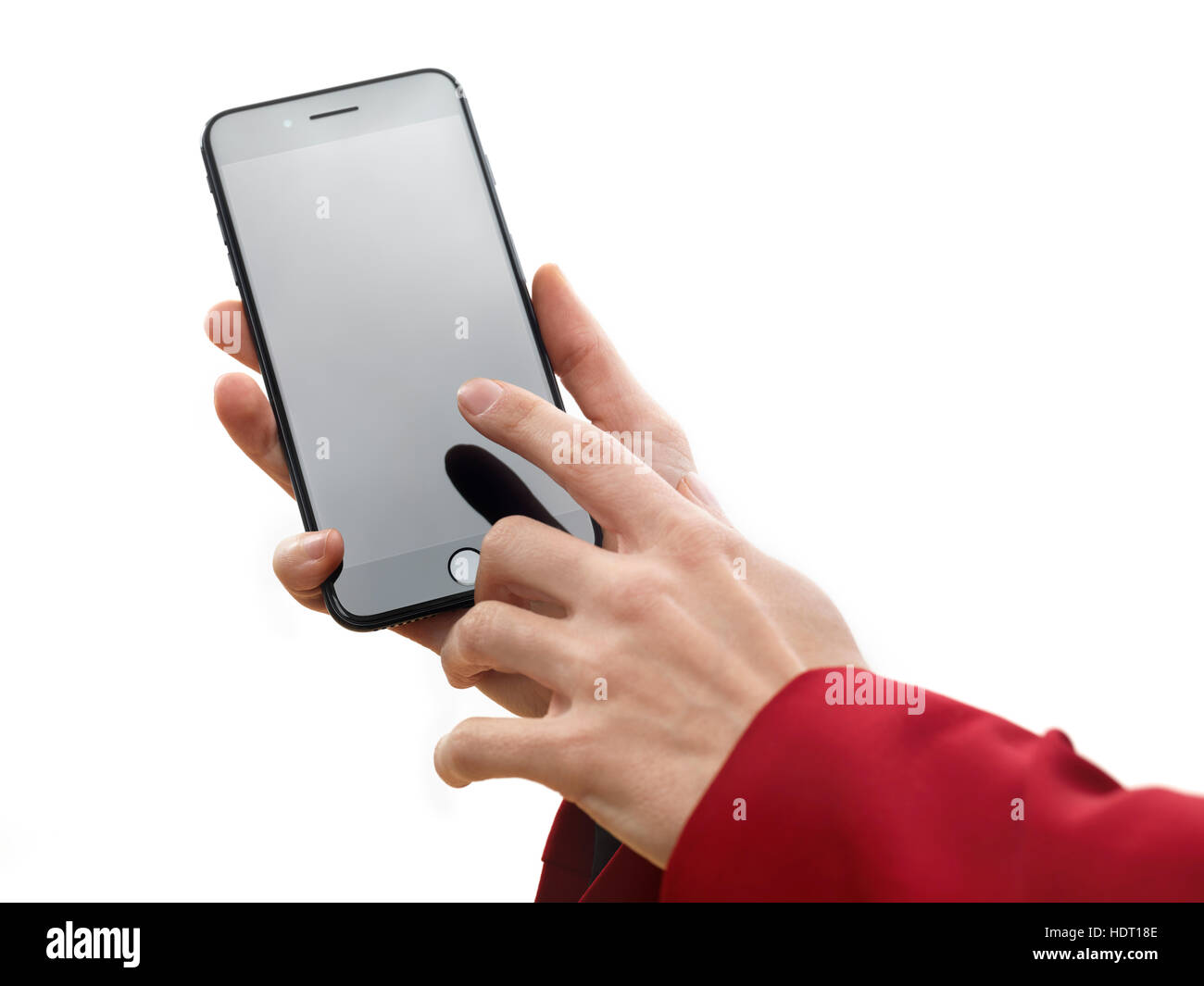 Woman hand holding Apple iPhone 7 Plus and touching blank screen with a finger isolated on white background Stock Photo