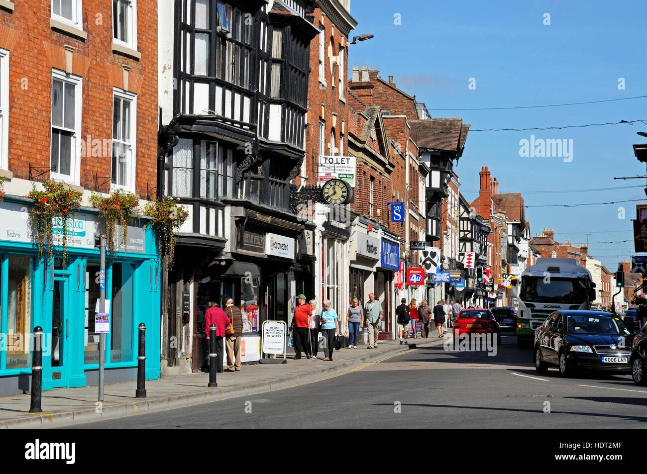 View of shops and shoppers along the High Street, Tewkesbury