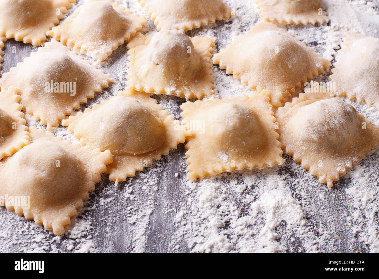 Italian uncooked ravioli with flour on the table. horizontal Stock Photo