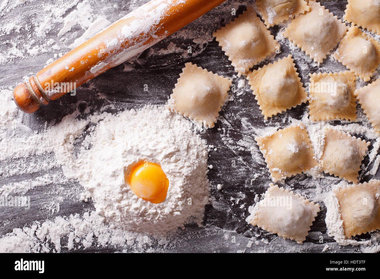 Italian ravioli with raw ingredients on the table. horizontal view from above Stock Photo