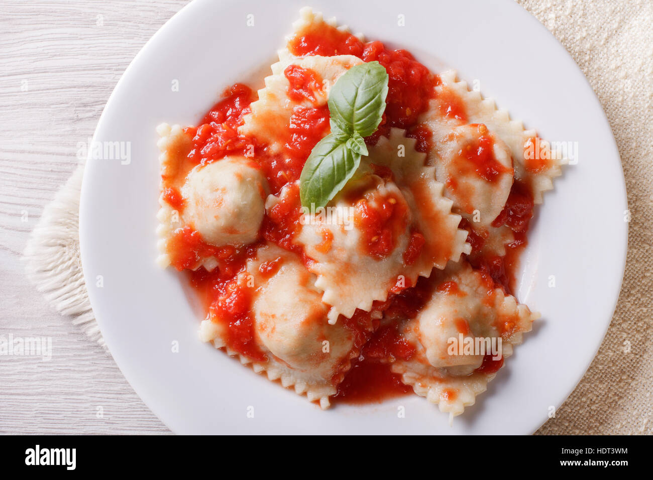 Ravioli with tomato sauce on a plate close-up. horizontal view from above Stock Photo