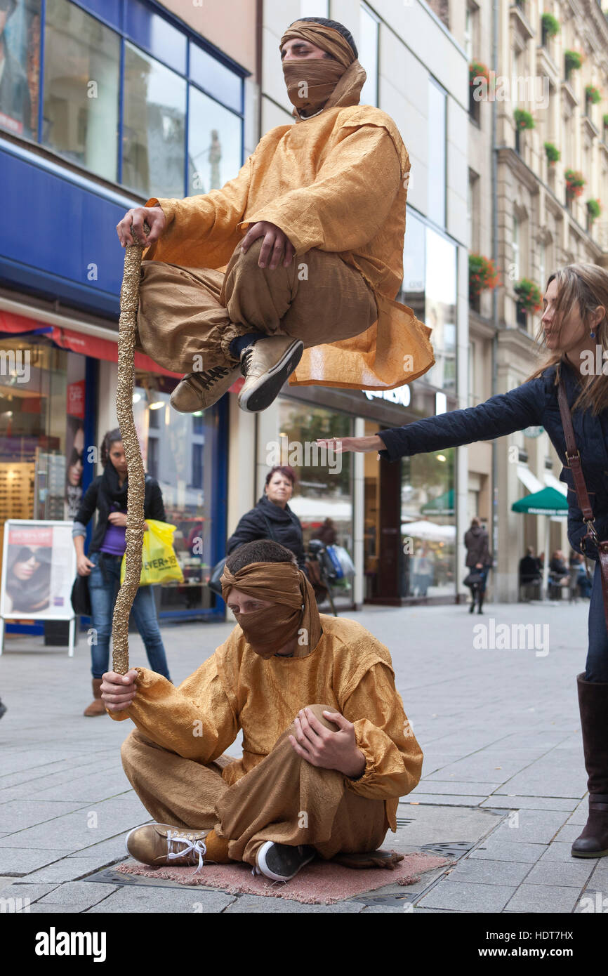 Germany, Cologne, street performer in the street Hohe Strasse. Stock Photo