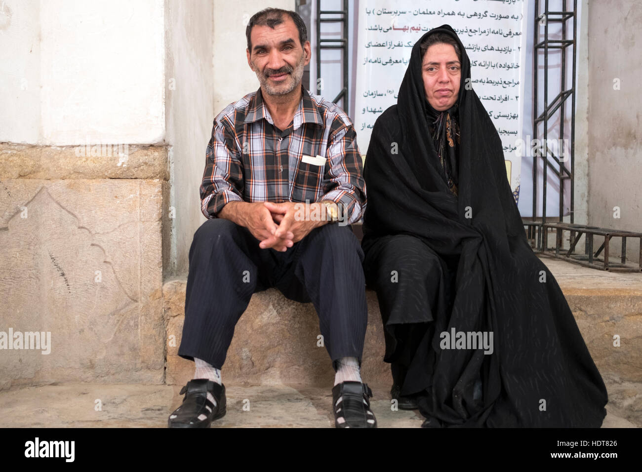 A middle aged couple rest at the Eram Gardens in Shiraz, Fars Province, Iran Stock Photo