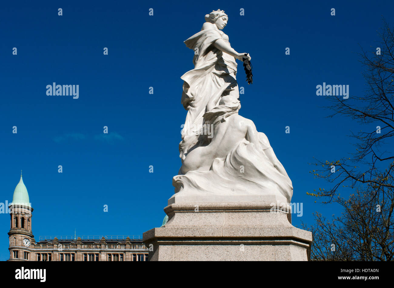 Titanic Memorial sculpture and The Cleaver Building on the junction of Donegall Square North and Donegall Place in Belfast, Northern Ireland, UK. Robi Stock Photo