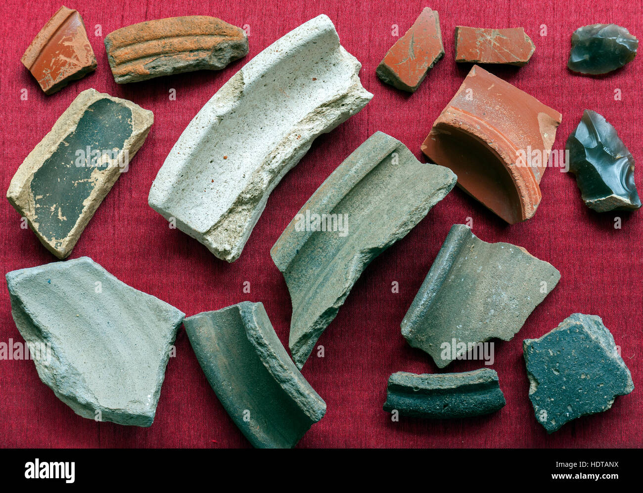 Roman pottery shards and flints found field walking Stock Photo Alamy