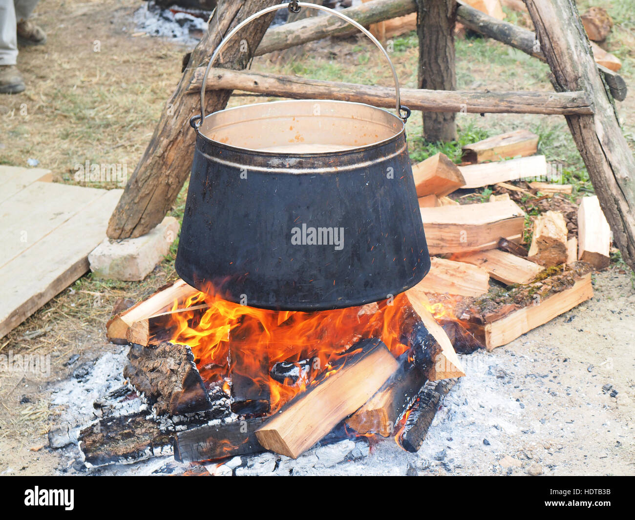Tripod with kettle ready for cooking fish paprikas(dish caracteristic