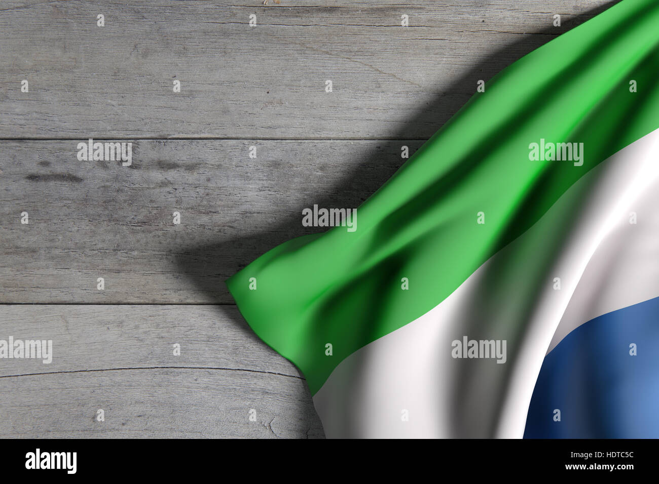 3d rendering of a Republic of Sierra Leone flag waving on wooden ...