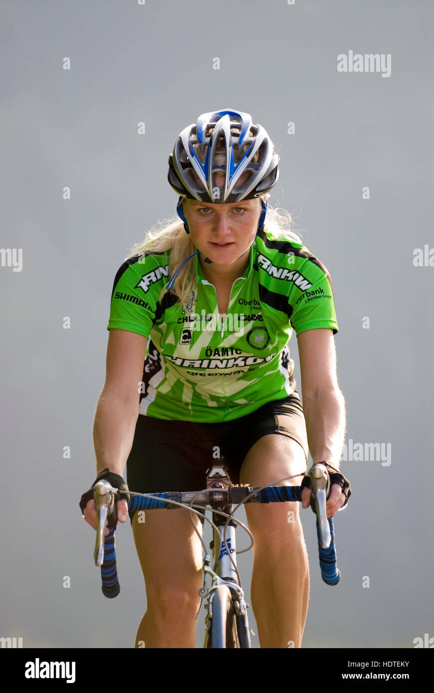 Woman riding a racing bicycle Stock Photo - Alamy