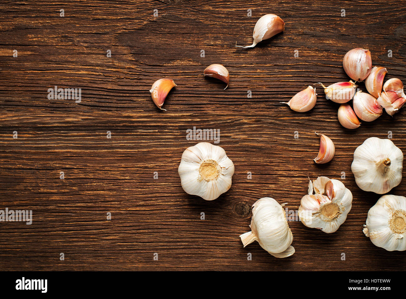 Garlic cloves on wooden vintage background Stock Photo - Alamy