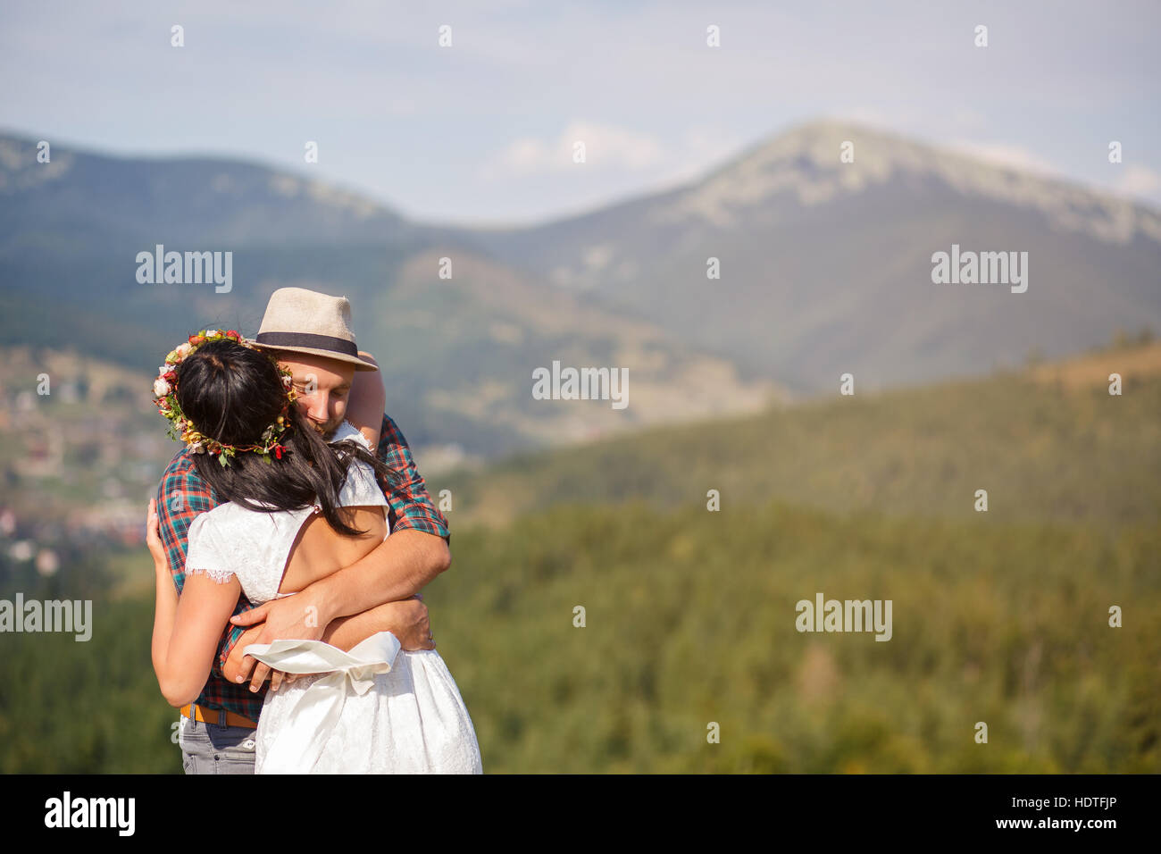 wedding in mountains. happy couple in love hugging Stock Photo