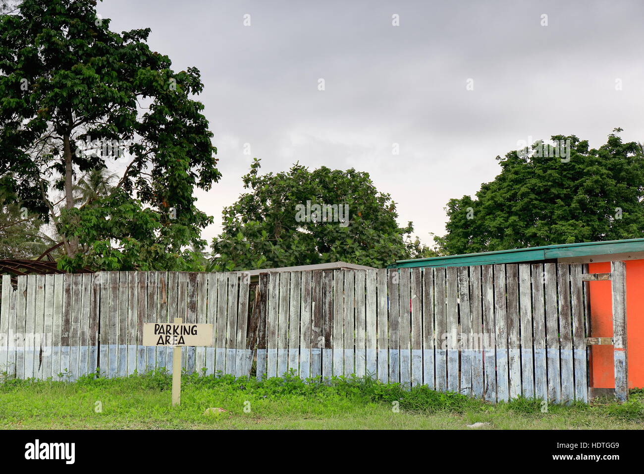 Parking area marked on a wood palisade limited lawn beside the chief marketplace in town at the West end of the main street-Higginson Boulevard. Lugan Stock Photo