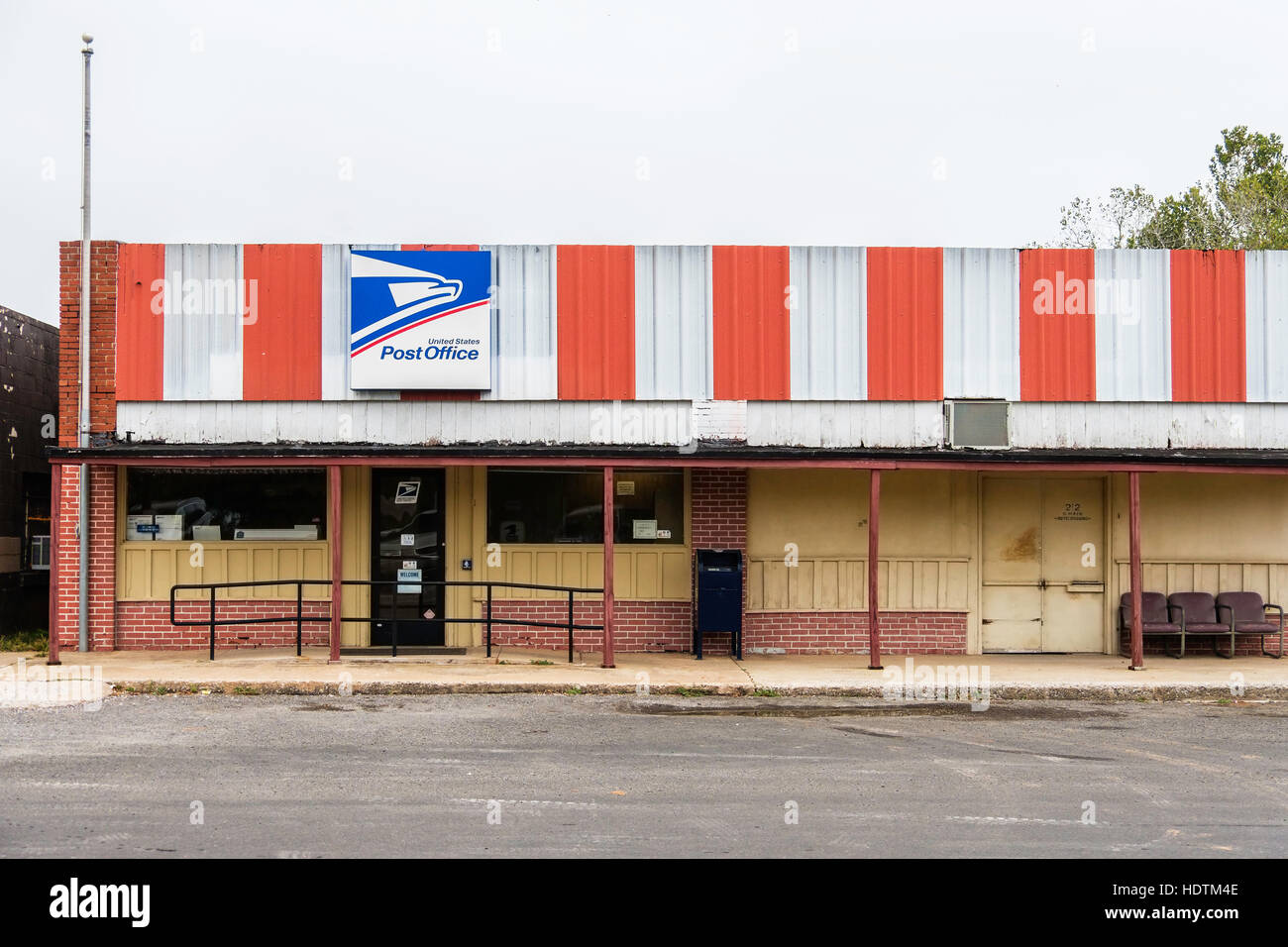 The front entrance of a small Post Office in an old building in the