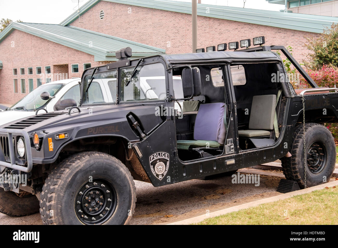 A HumVee police tactical vehicle parked in the parking lot of the City of Purcell, Oklahoma, USA  Public Safety Complex Stock Photo