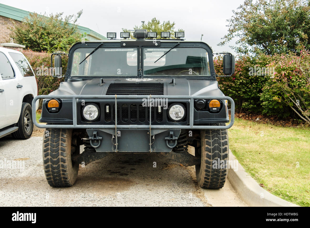 A HumVee police tactical vehicle parked in the parking lot of the City of Purcell, Oklahoma, Public Safety Complex Stock Photo