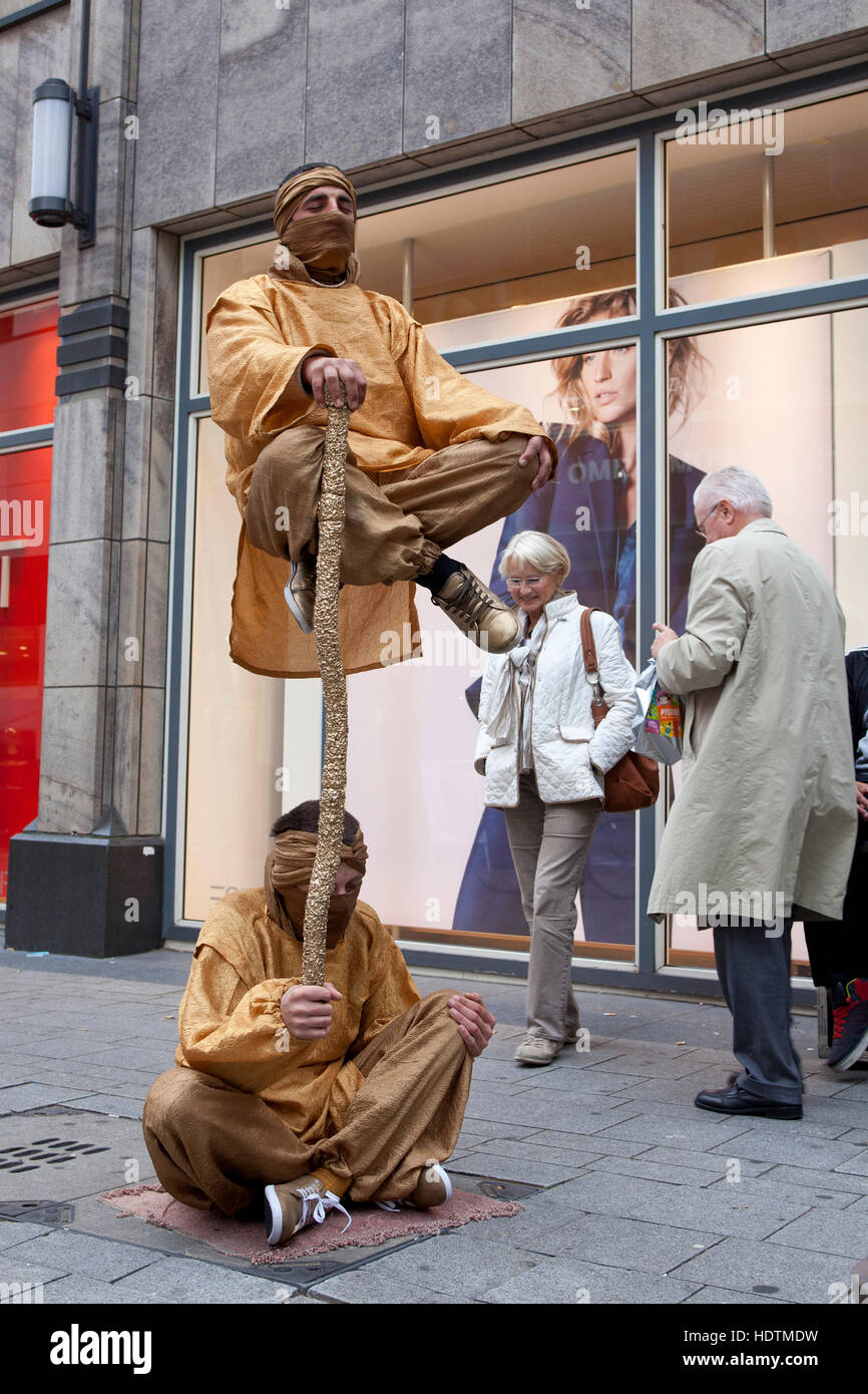 Germany, Cologne, street performer in the street Hohe Strasse. Stock Photo