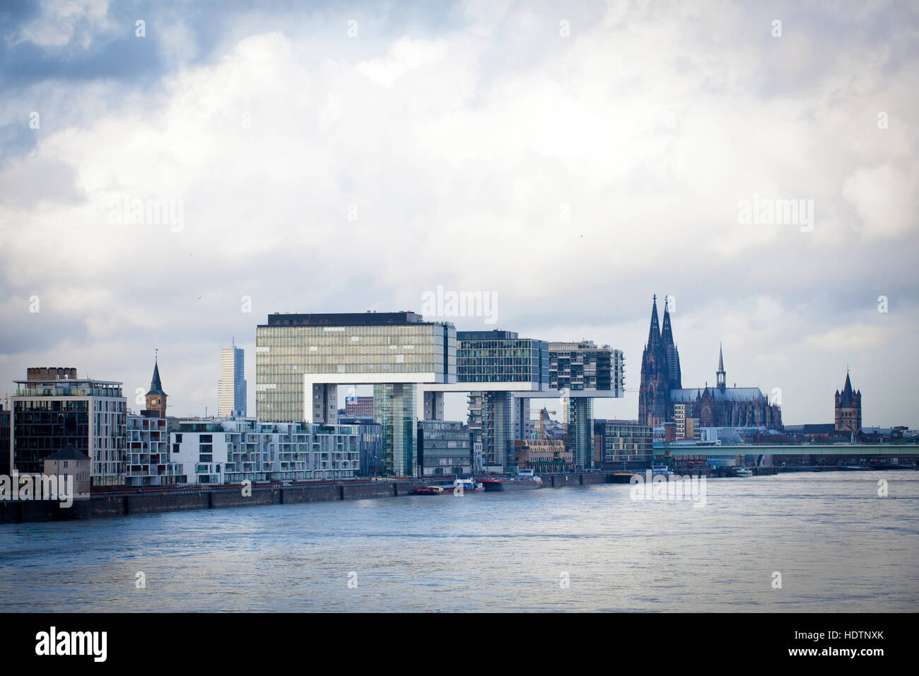 Germany, Cologne, the Crane Houses at the Rheinau harbour, architect Hadi Teherani, the cathedral Stock Photo