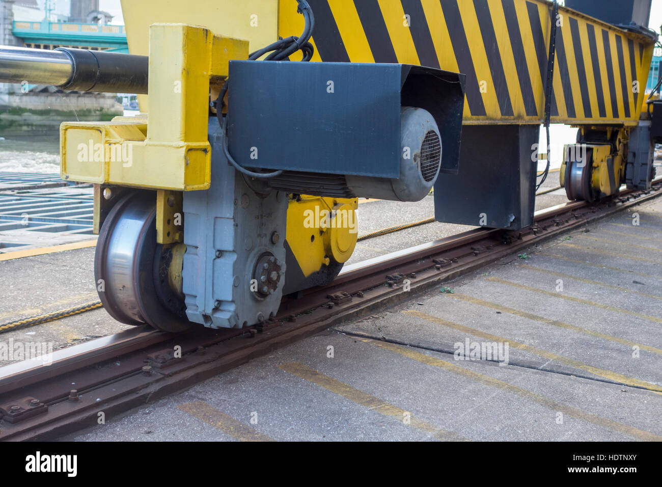 Close up of track and wheels on a large lifting crane at Walbrook Wharf