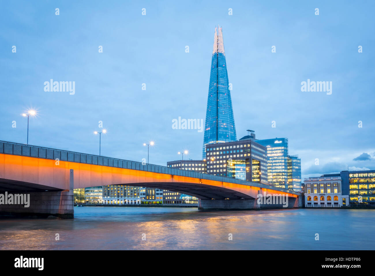 London skyline at dusk with London Bridge and The Shard in view over the River Thames Stock Photo