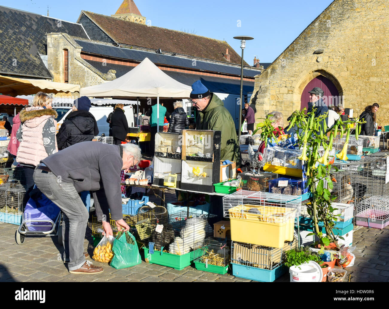 French shoppers bundle up against the cold weather as they shop at the