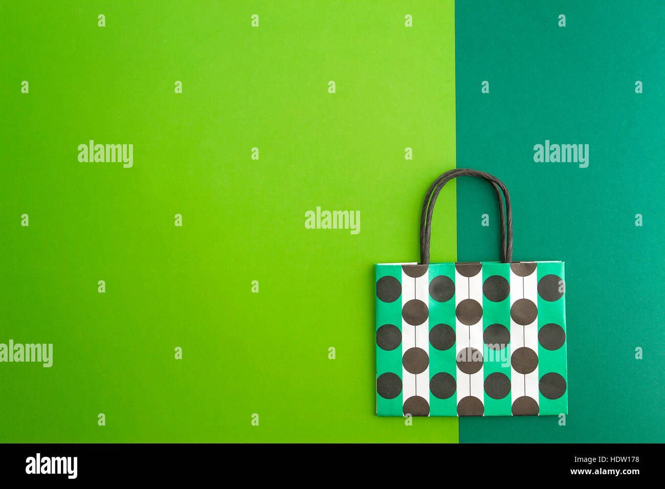 Colourful shopping bag on a green and greenery background Stock Photo ...