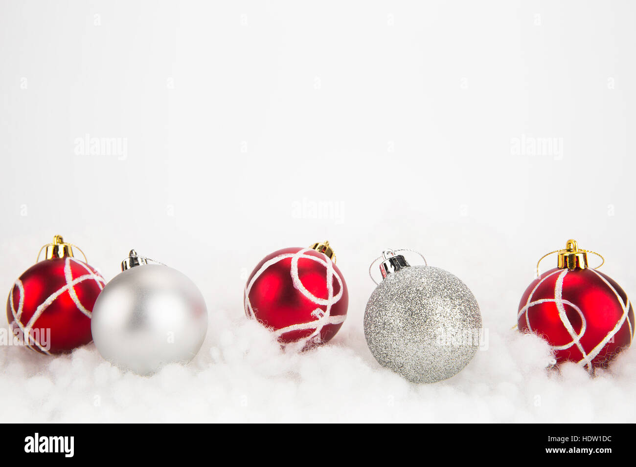 Red and silver Christmas balls on abstract white background Stock Photo ...