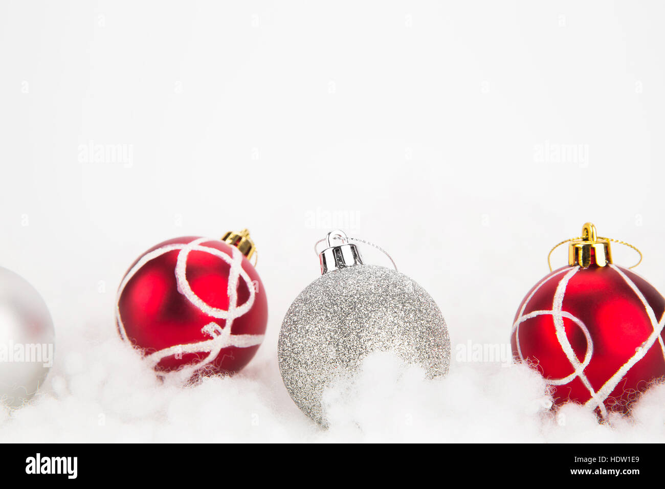 Red and silver Christmas balls on abstract white background Stock Photo ...