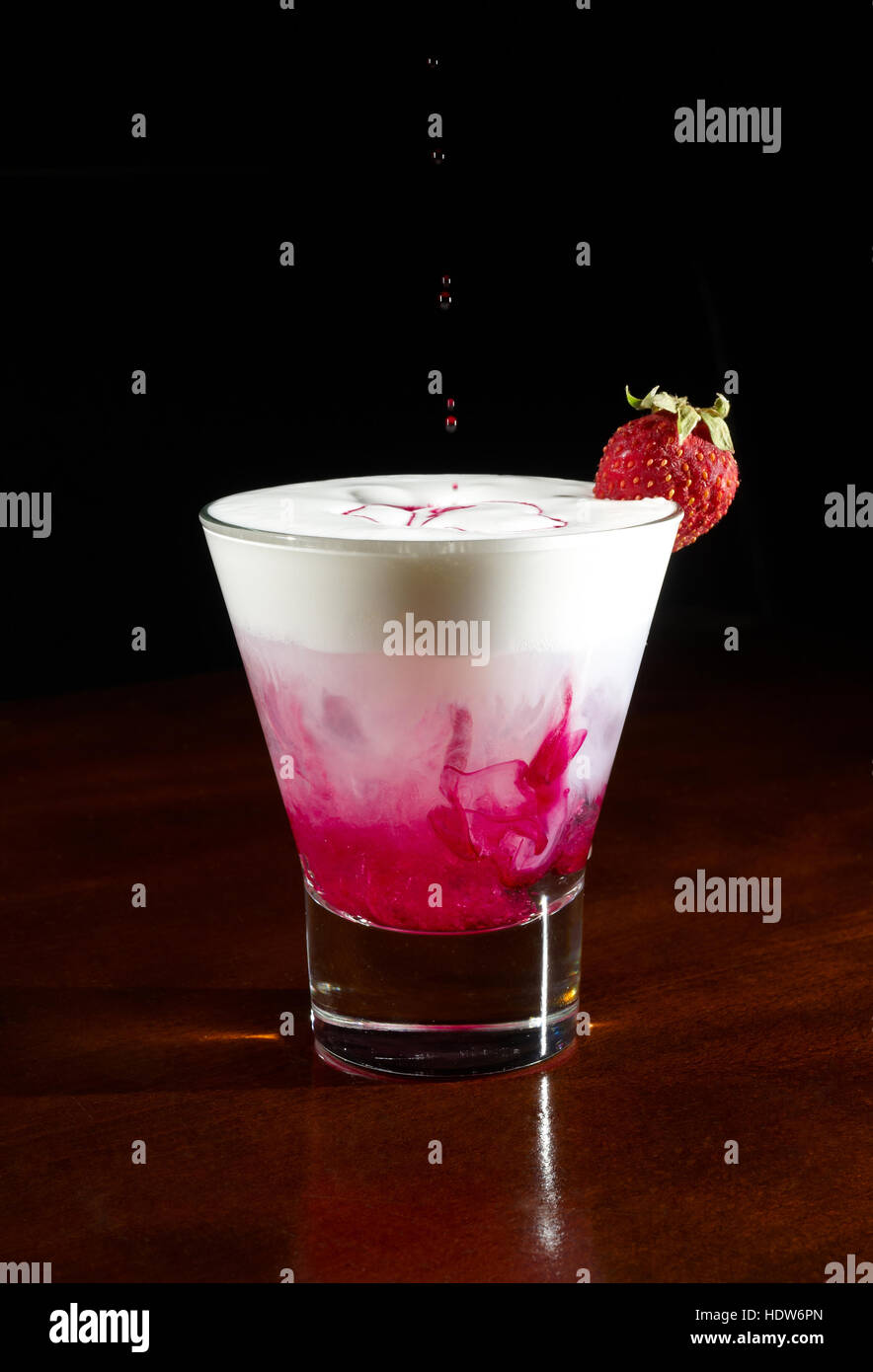 Glass of cocktail with vodka gin milk and grenadine Stock Photo - Alamy