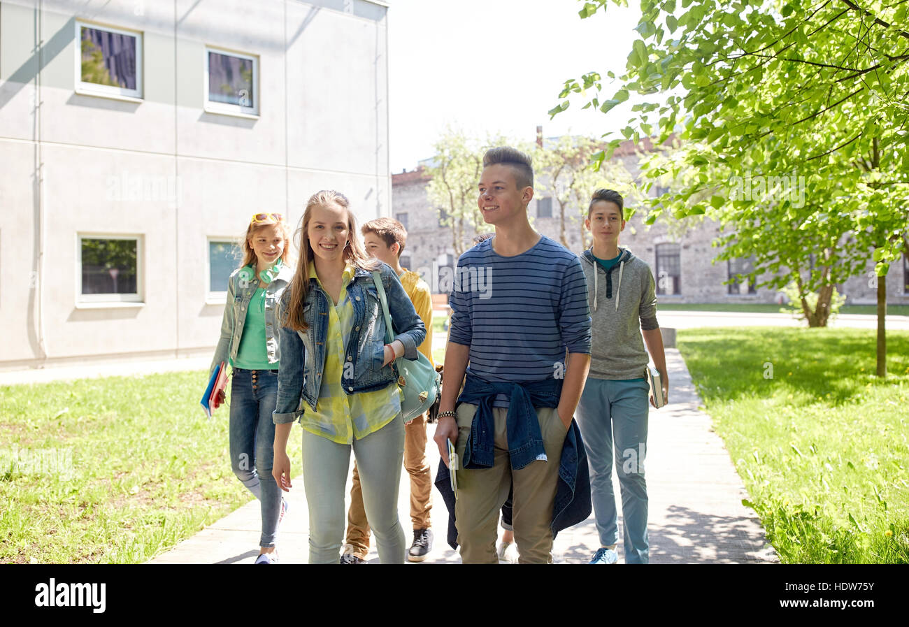 group of happy teenage students walking outdoors Stock Photo - Alamy