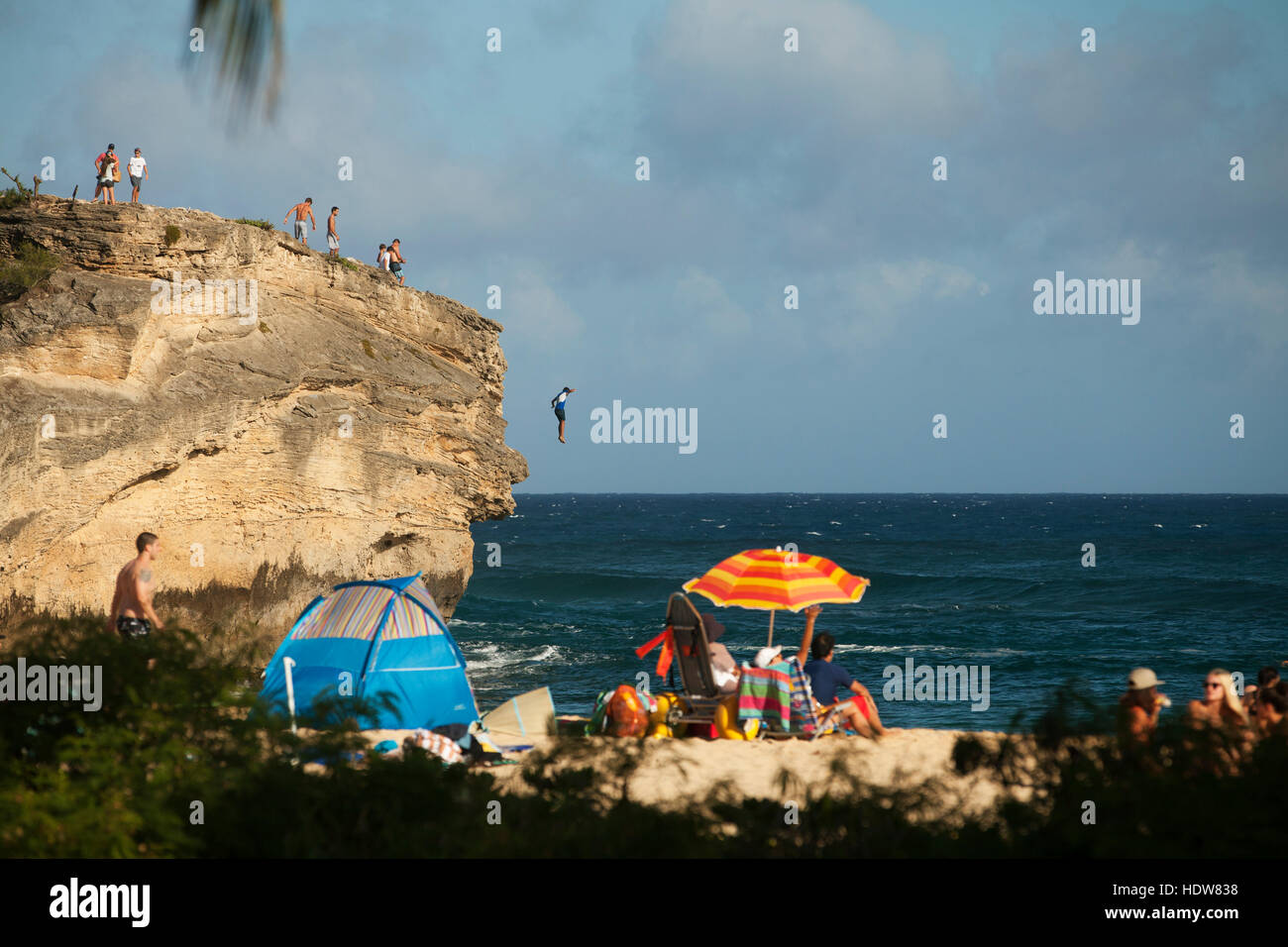 Cliff jumping and beach goers, Keoniloa Beach and Bay, also known as