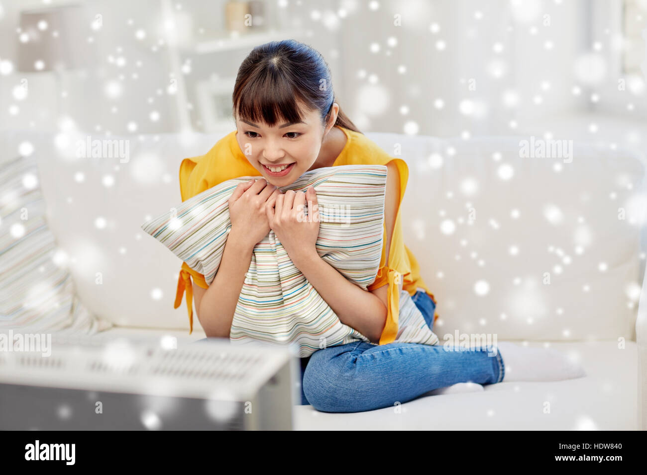 happy asian young woman watching tv at home Stock Photo