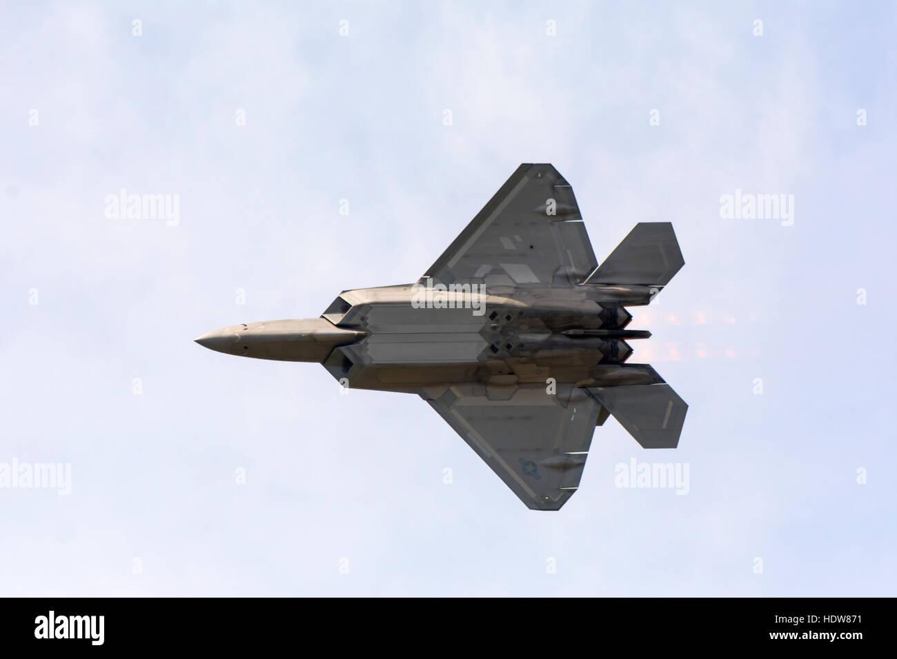 A stealth F 22 Raptor fighter jet in flight showing it's underside; Edmonton, Alberta, Canada Stock Photo