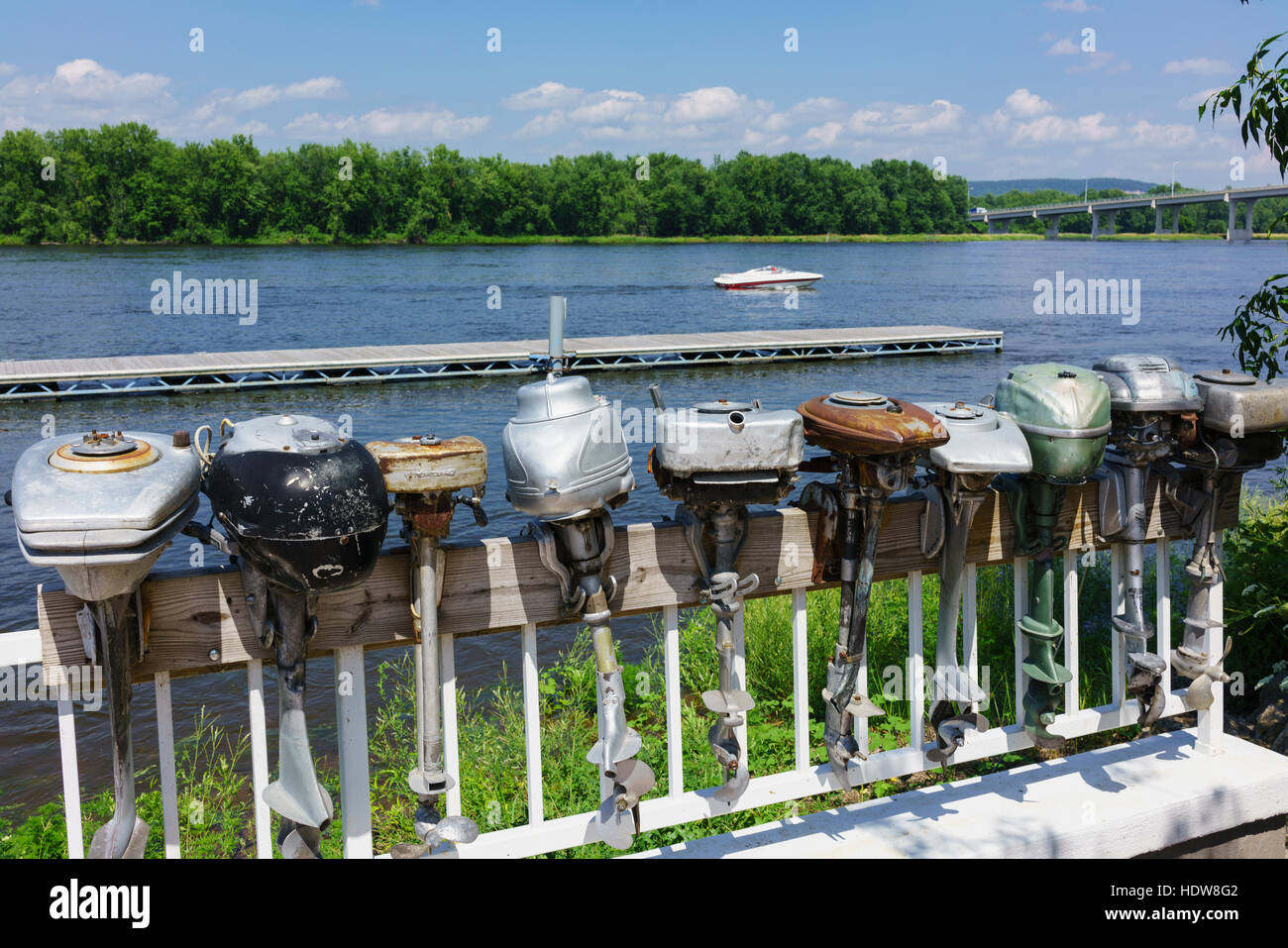 Display of antique outboard motors along the Mississippi River; Wabasha
