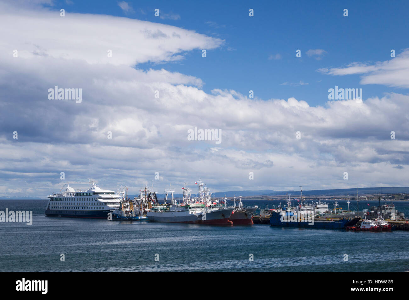 Cruise ship and crab boats at pier in Punta Arenas; Punta Arenas, Magallanes and Antartica Chilena, Chile Stock Photo
