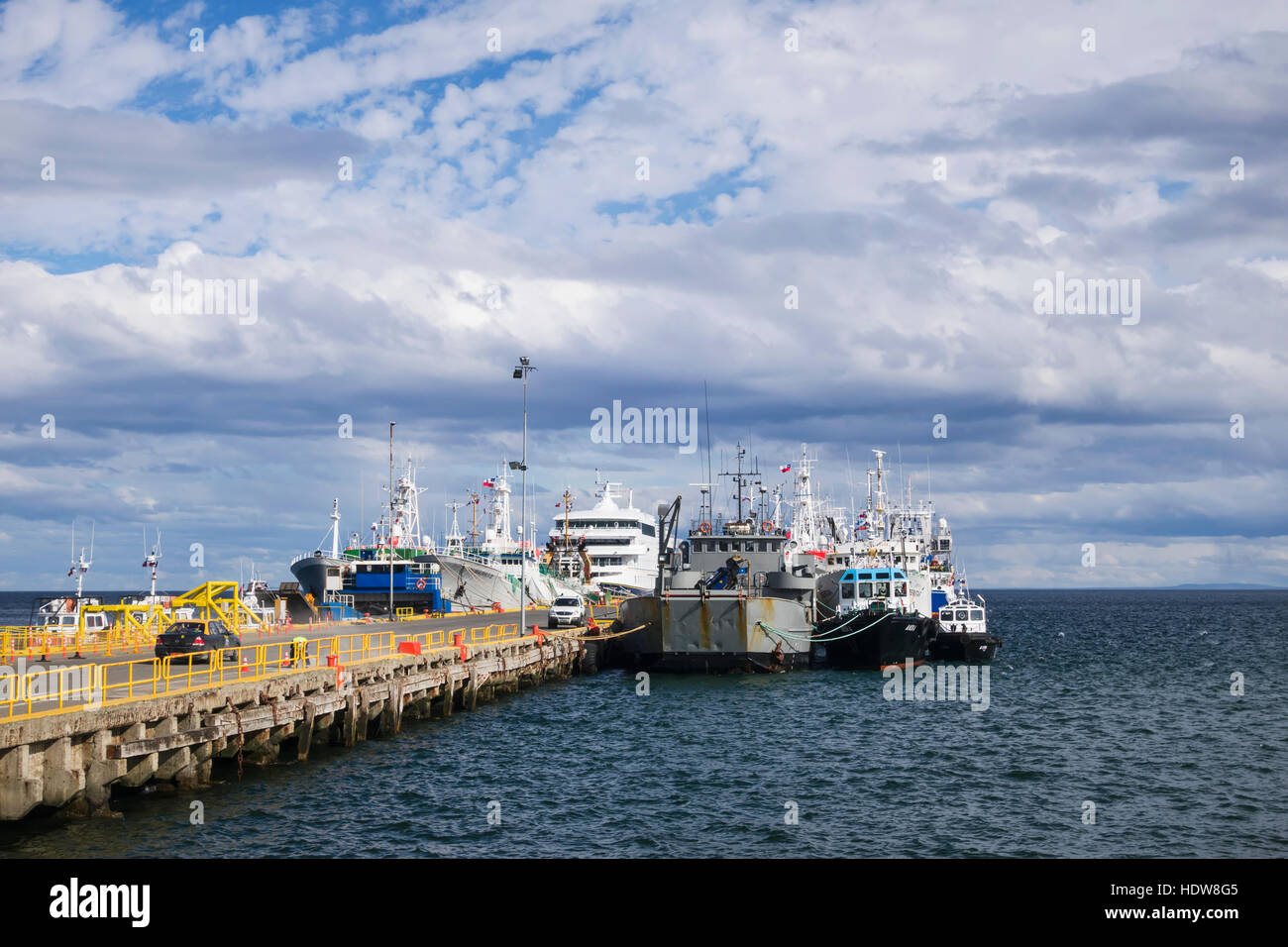 Cruise ship and crab boats at pier in Punta Arenas; Punta Arenas, Magallanes and Antartica Chilena, Chile Stock Photo