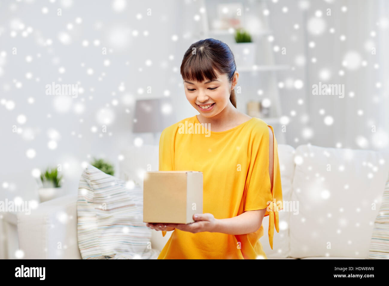 happy asian young woman with parcel box at home Stock Photo - Alamy