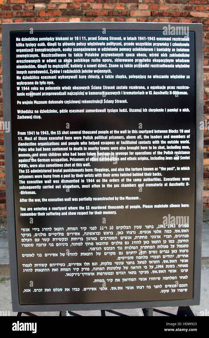 A visitor's information board of The death Wall at Auschwitz Birkenau, Oswiecim, Poland. Stock Photo