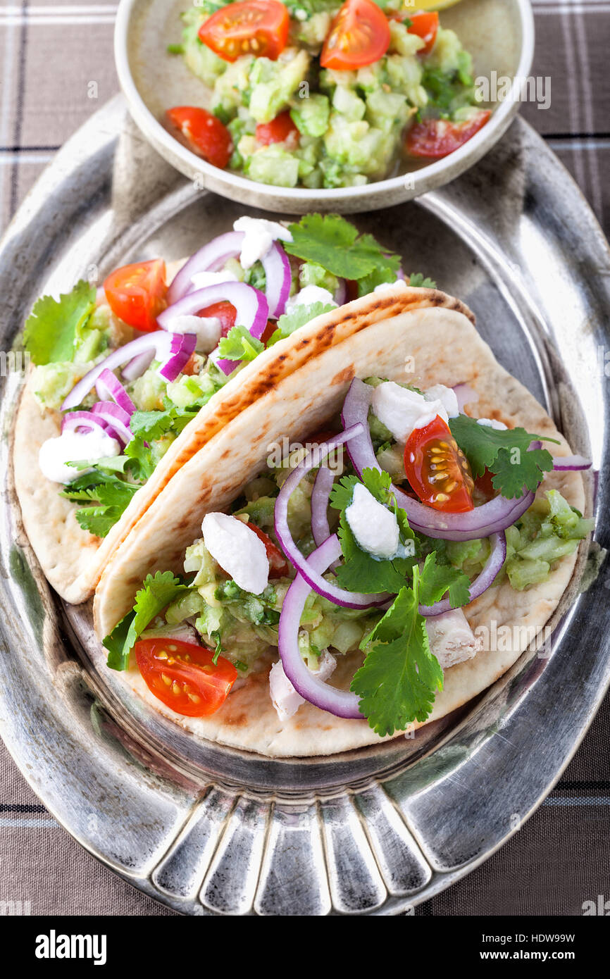 Chicken Tacos with vegetables on a pad Stock Photo Alamy