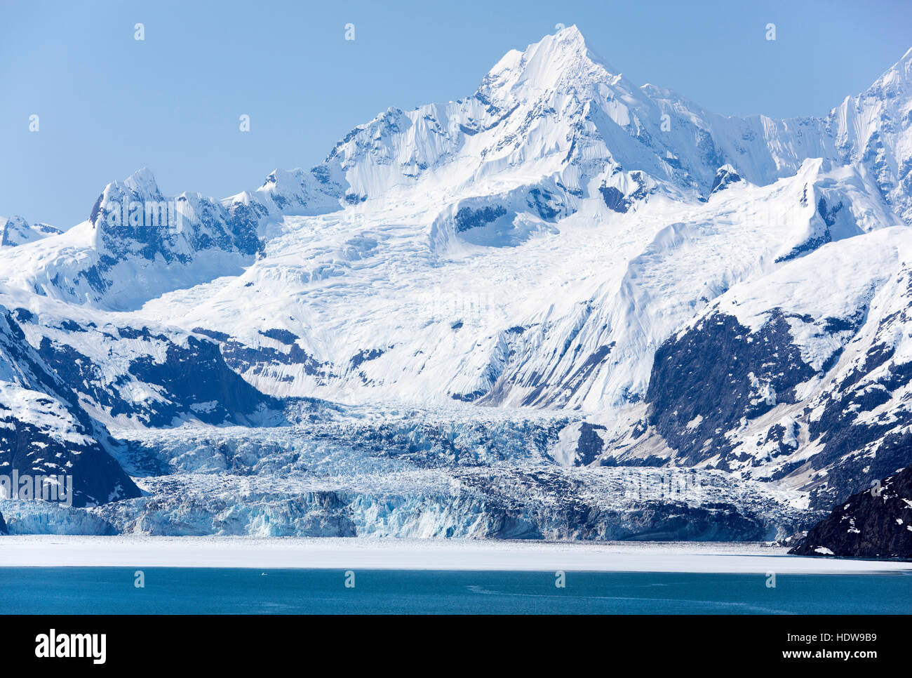 The scenic view of a glacier next to the mountain in Glacier Bay national park (Alaska). Stock Photo