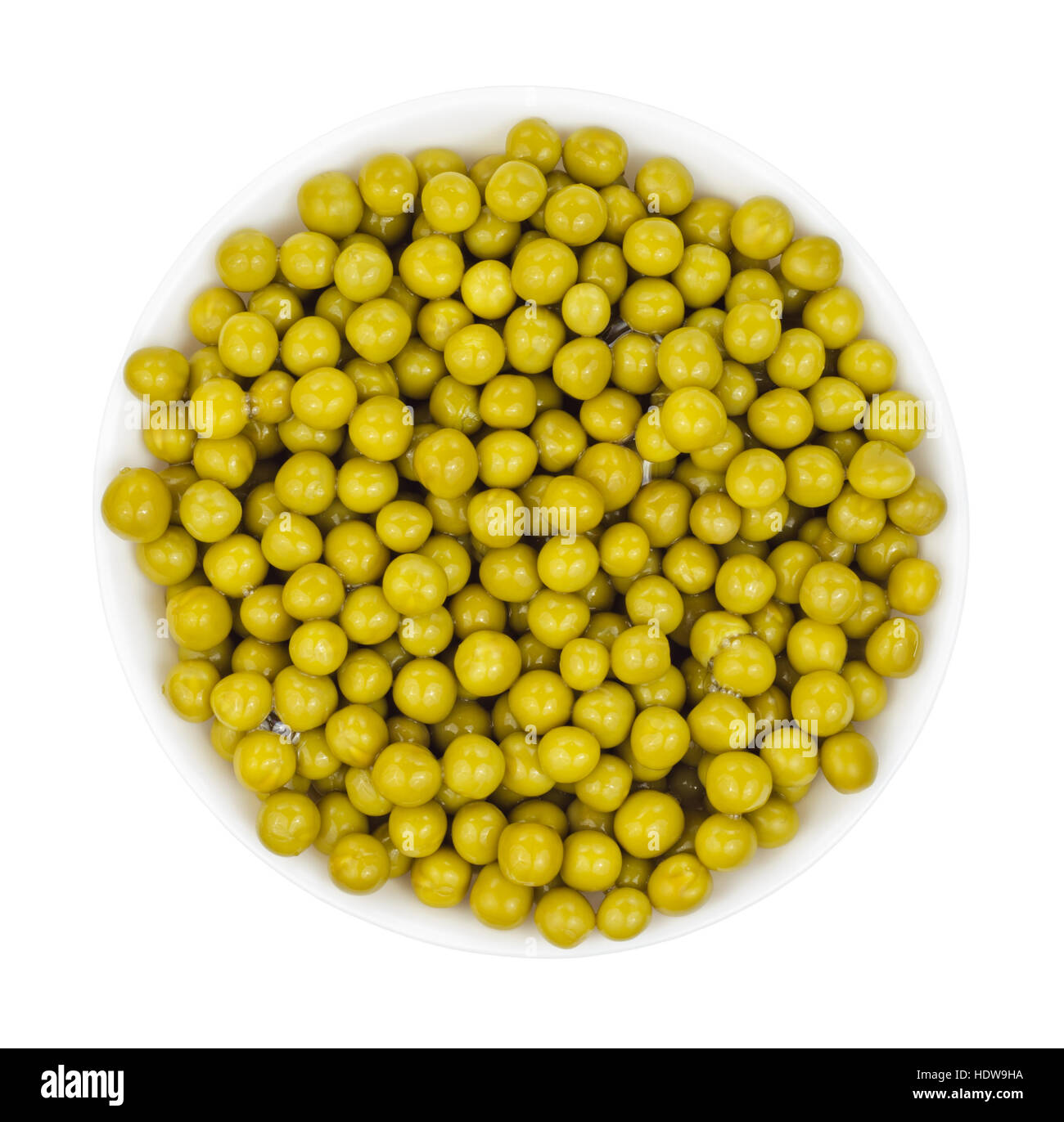 Marinated green peas in bowl isolated on white background. Top view
