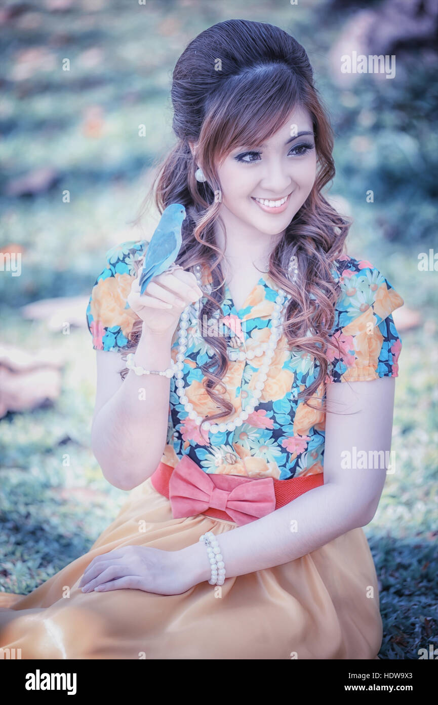 asia beautiful girl in the yellow dress on nature Stock Photo - Alamy