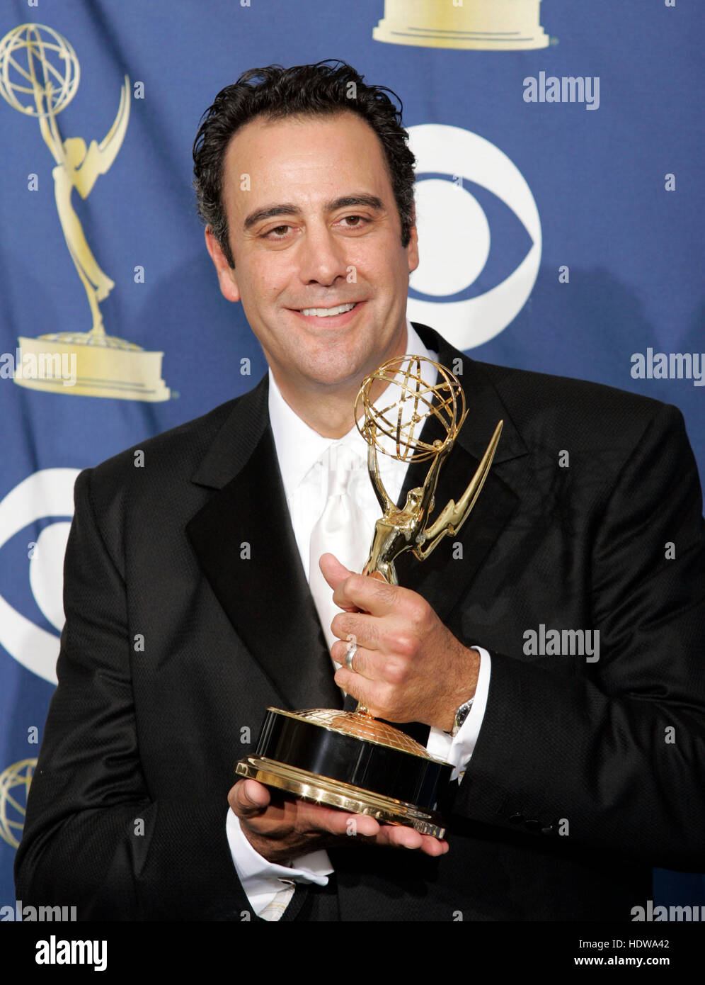 Actor Brad Garrett holds his award at the 57th Annual Emmy Awards at