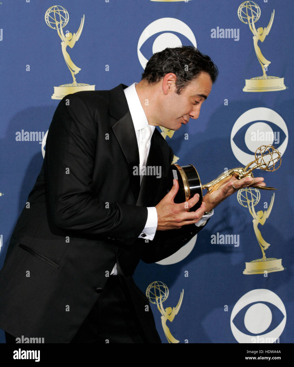 Actor Brad Garrett holds his award at the 57th Annual Emmy Awards at