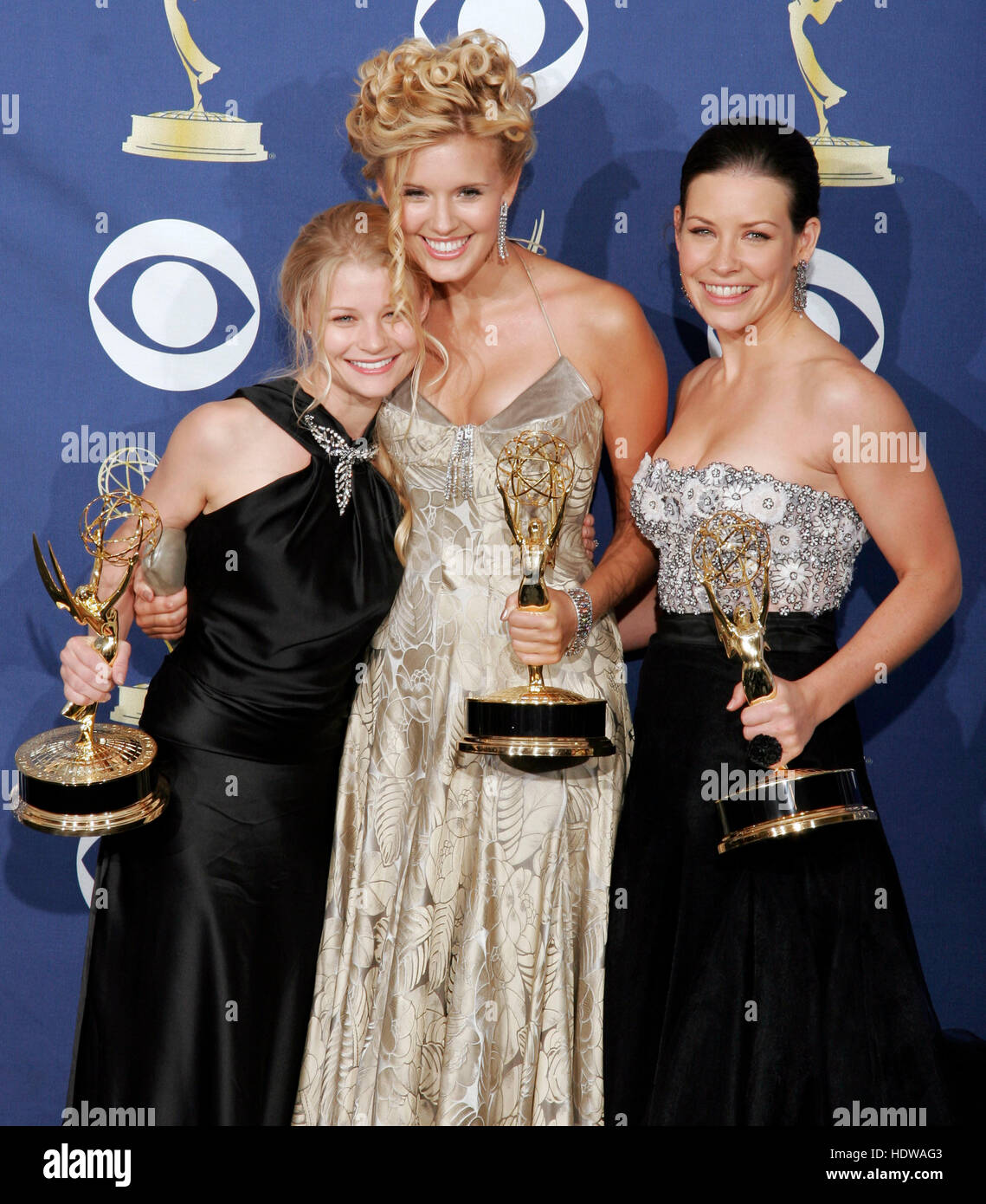 Emilie de Ravin, Maggie Grace, and Evangeline Lilly, from the cast of 'Lost', winner of best drama at the 57th Annual Emmy Awards at the Shrine Auditorium in Los Angeles, September 18, 2005. Photo credit: Francis Specker Stock Photo