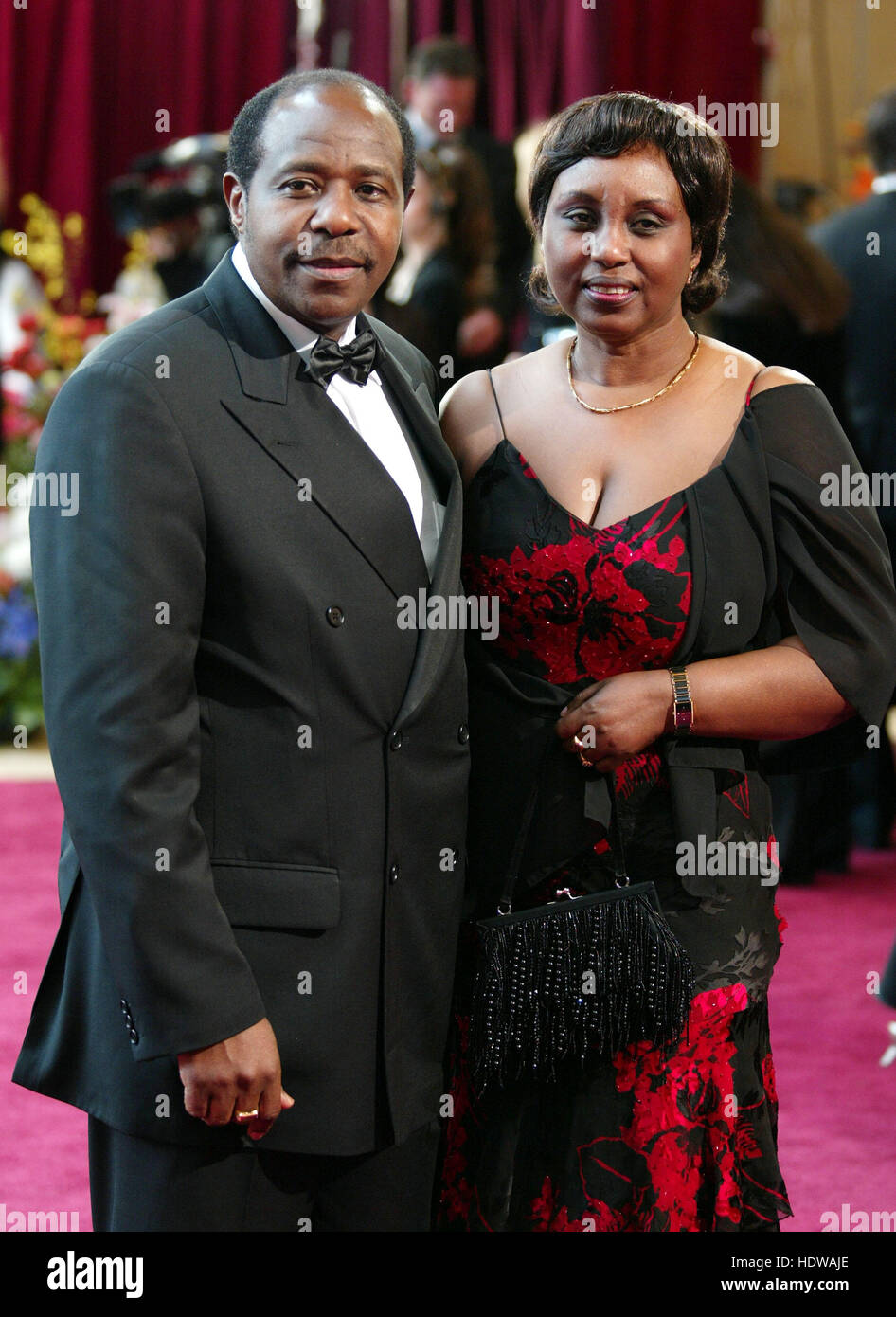 Paul Rusesabagina and his wife, Tatiana Rusesabagina arrives at the 77th Annual Academy Awards  in Los Angeles on Feb. 27, 2005. Photo credit: Francis Specker Stock Photo
