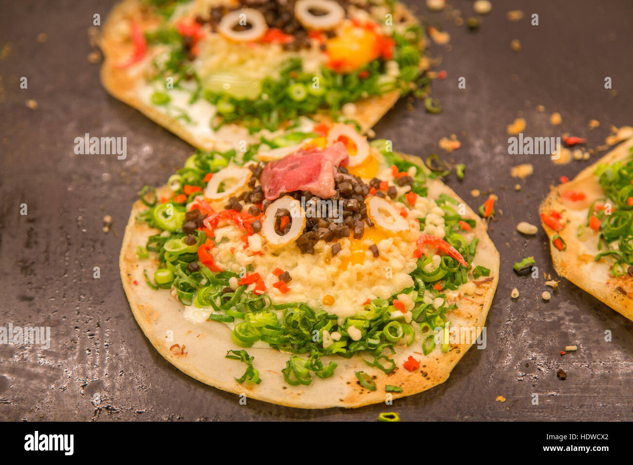Japanese traditional food, okonomiyaki or Japanese pizza Stock Photo