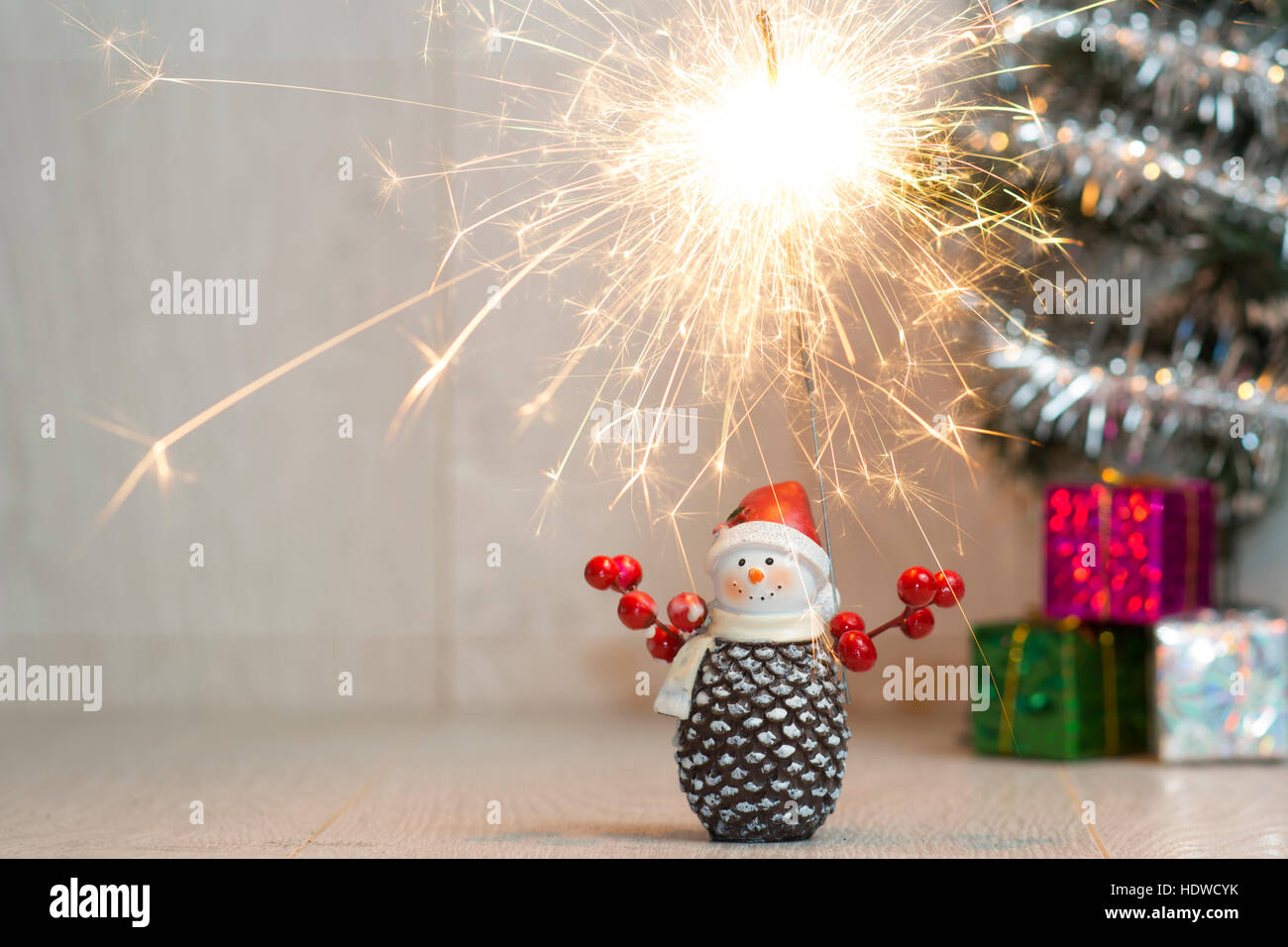 Christmas. Sparklers. Snowman. Gifts Stock Photo