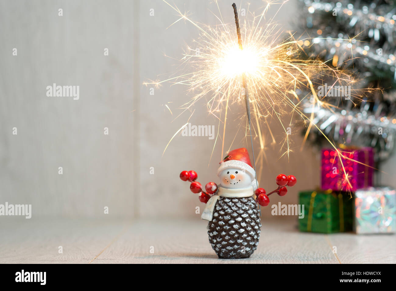 Christmas. Sparklers. Snowman. Gifts Stock Photo