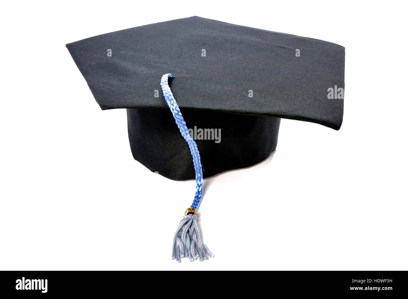 Graduation cap with blue tassel isolated over white background Stock