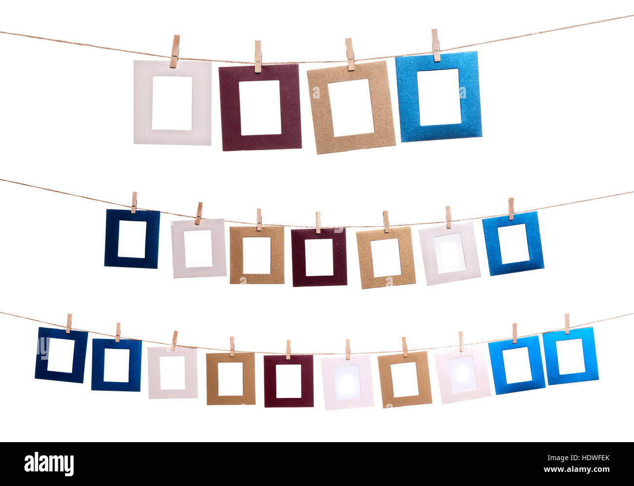 Collection of blank photo frames hanging by clothespins on a rope. You